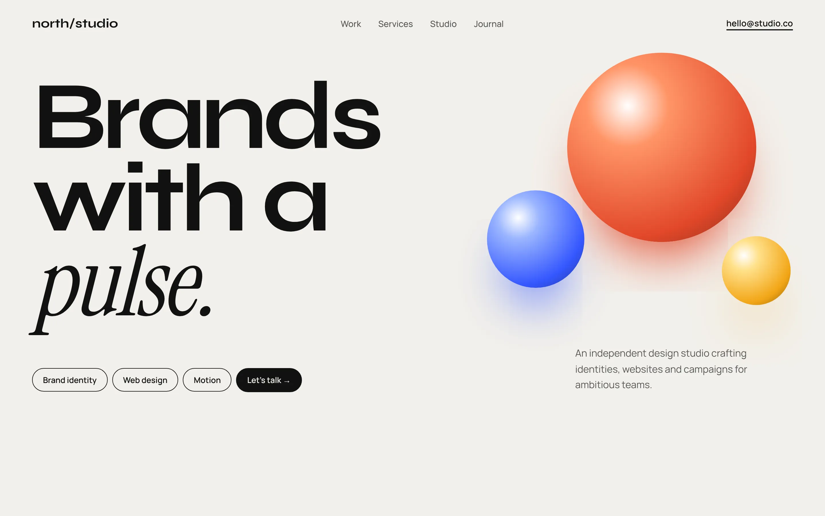 Design concept of a creative agency website with oversized type and glossy spheres